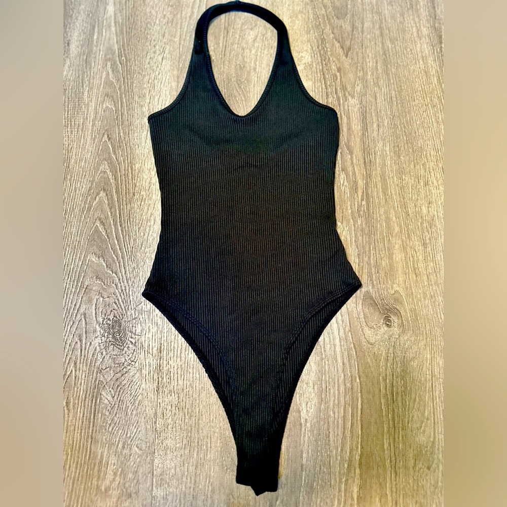 Black halter top bodysuit from SHEIN. Size small. Perfect for versatile styling.